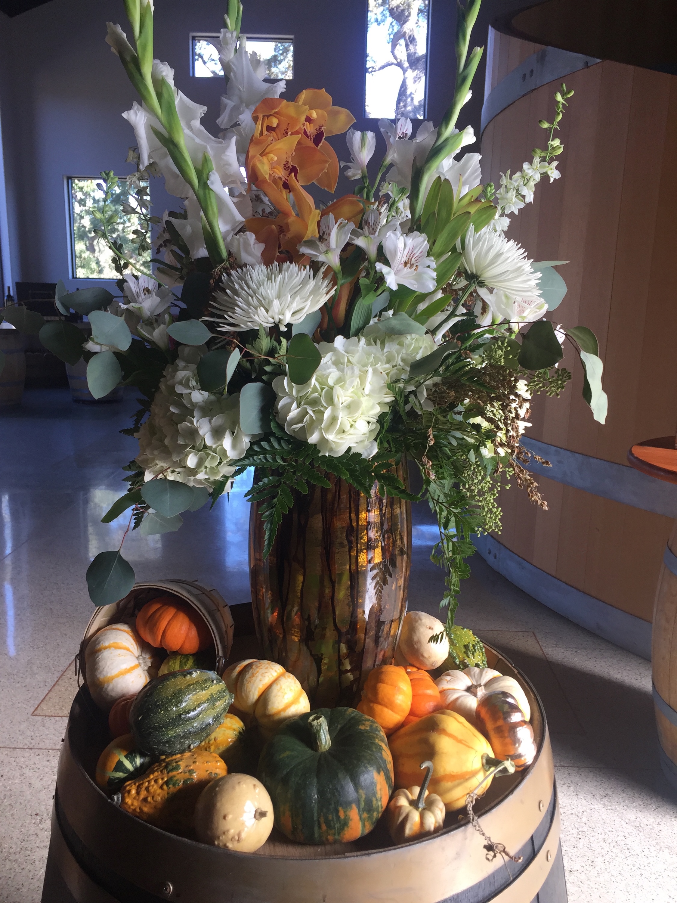 Gourds and small pumpkins add interest to a floral bouquet.