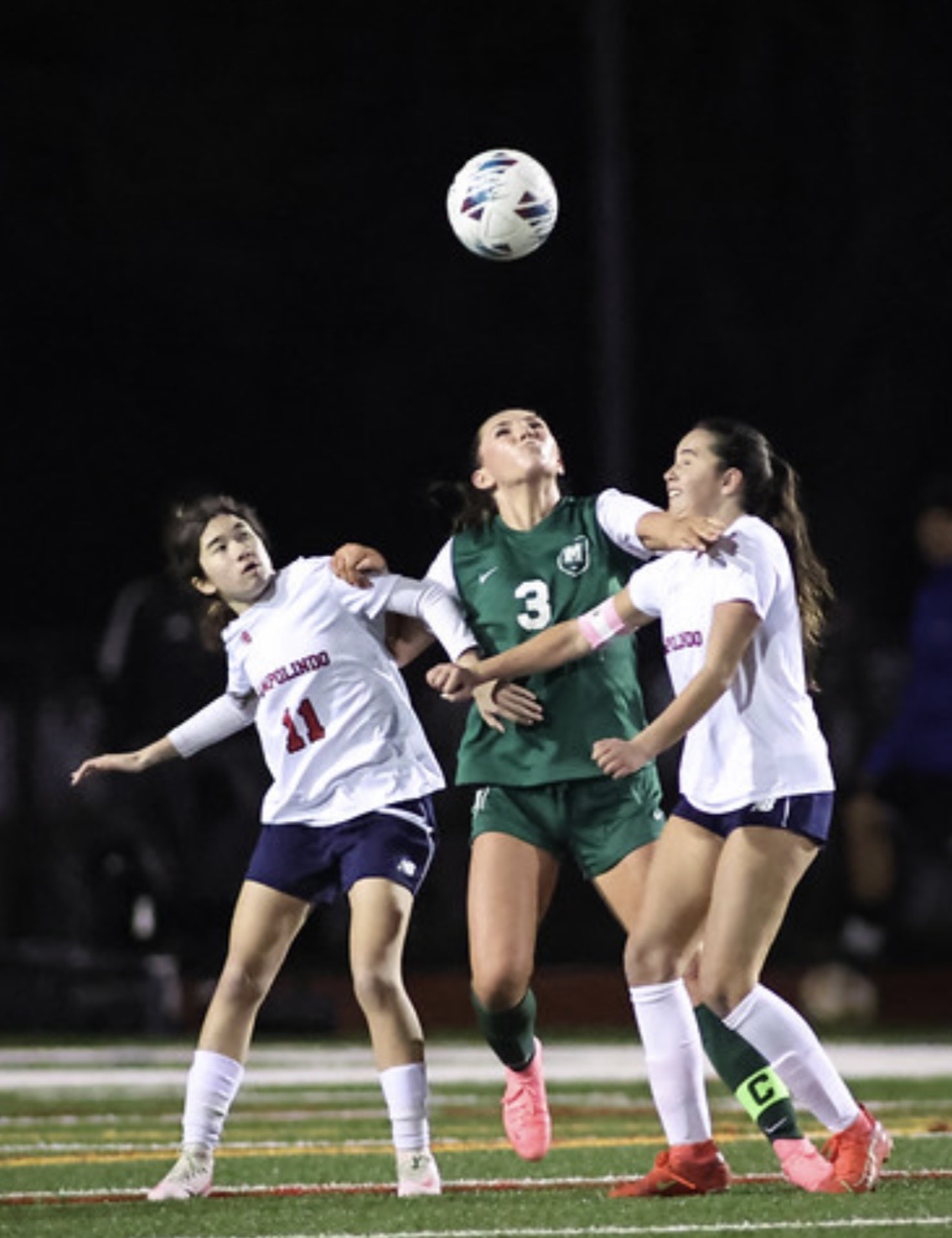 Campolindo’s Avery Corey (11) and Stella McLeod (right) battle Miramonte’s Eve Copeland (3).