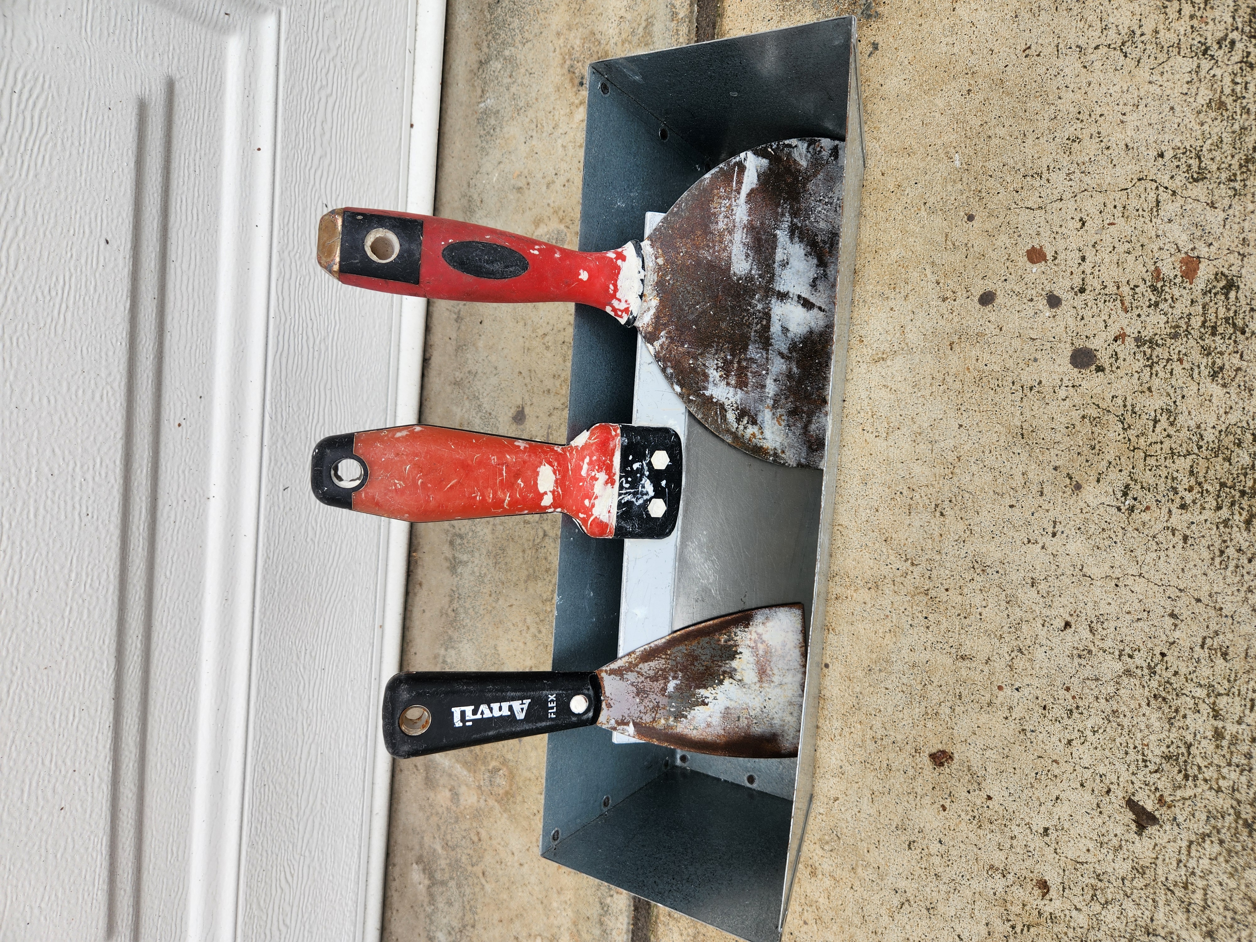 Here are my trusty old blades: A 12-inch, 3-inch, and 6- inch and my mud pan.