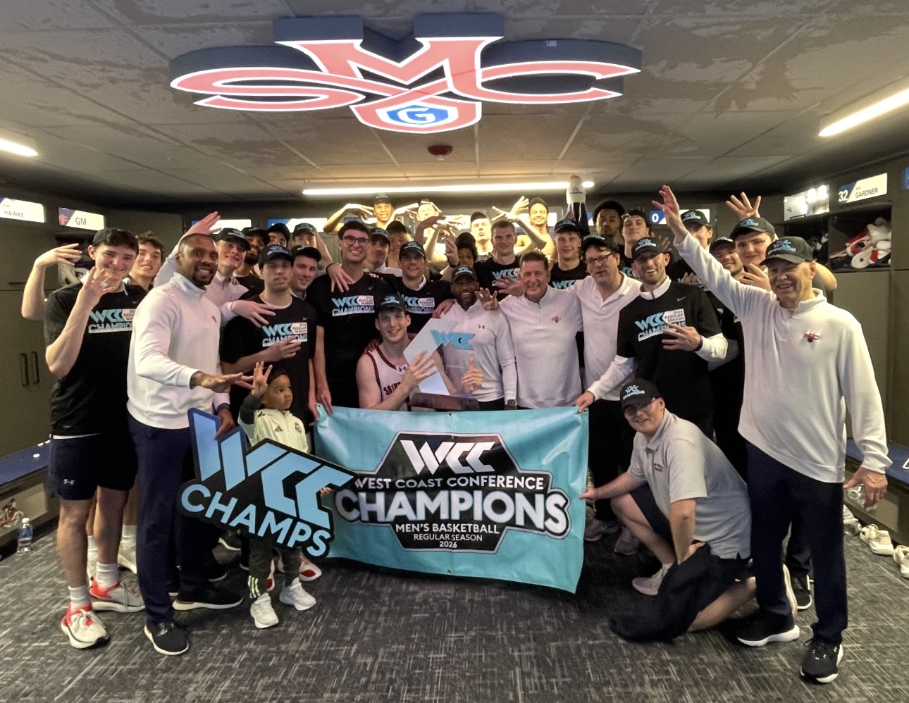 Saint Mary’s men’s basketball team and coaches celebrate their WCC victory.