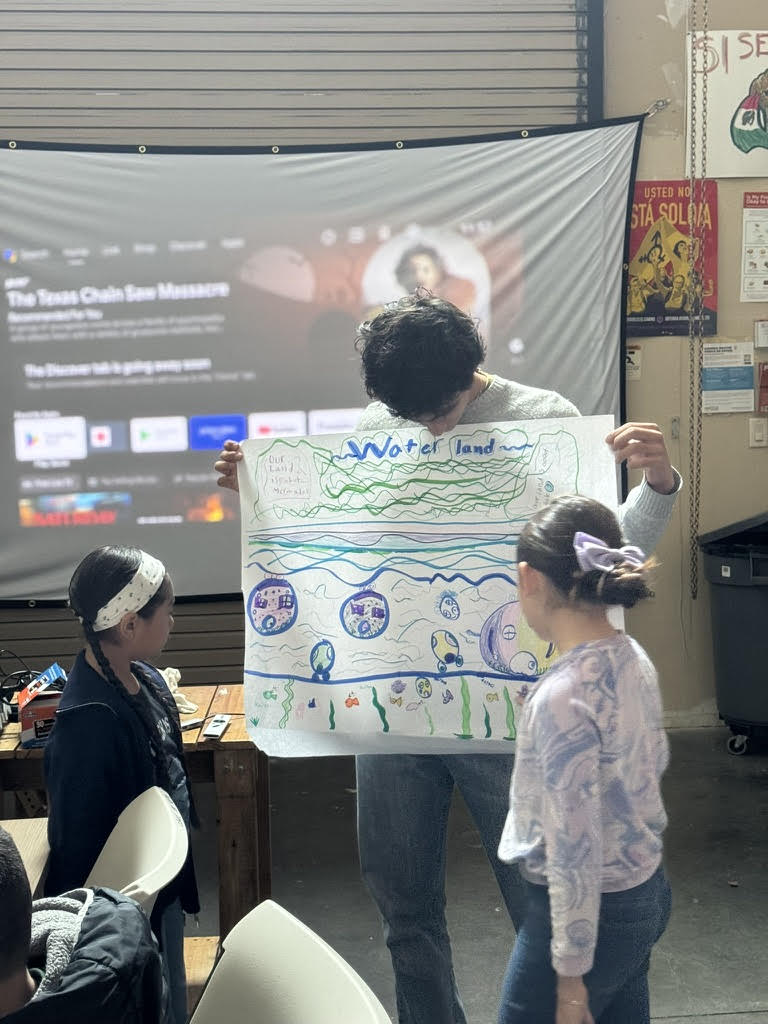 Camp participants draw their “dream cities” – this one with underwater neighborhoods.