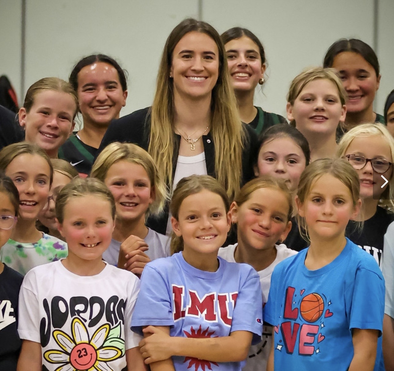 Sabrina Ionescu with kids from her skills clinic.