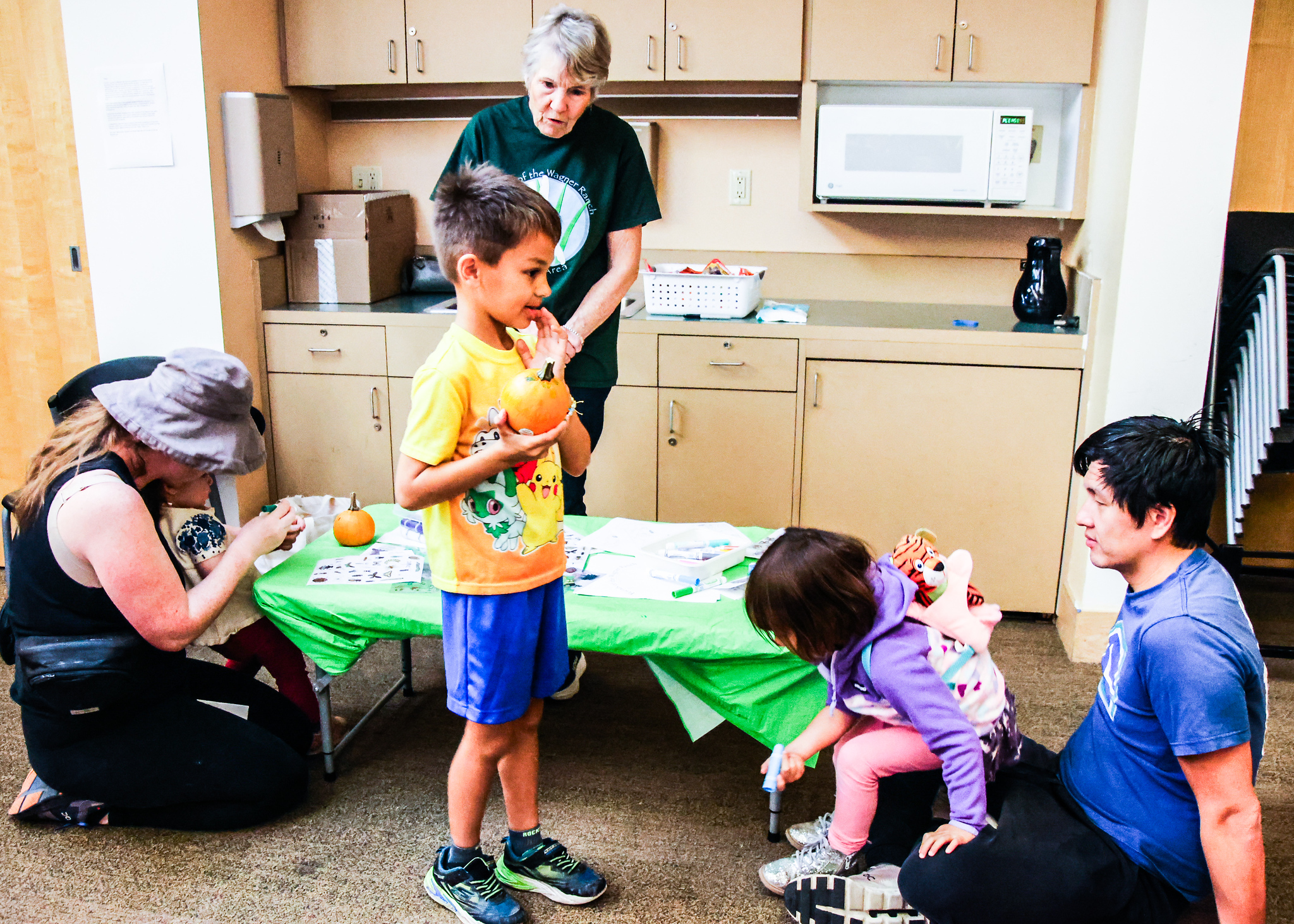 Children enjoy painting little pumpkins at the event.