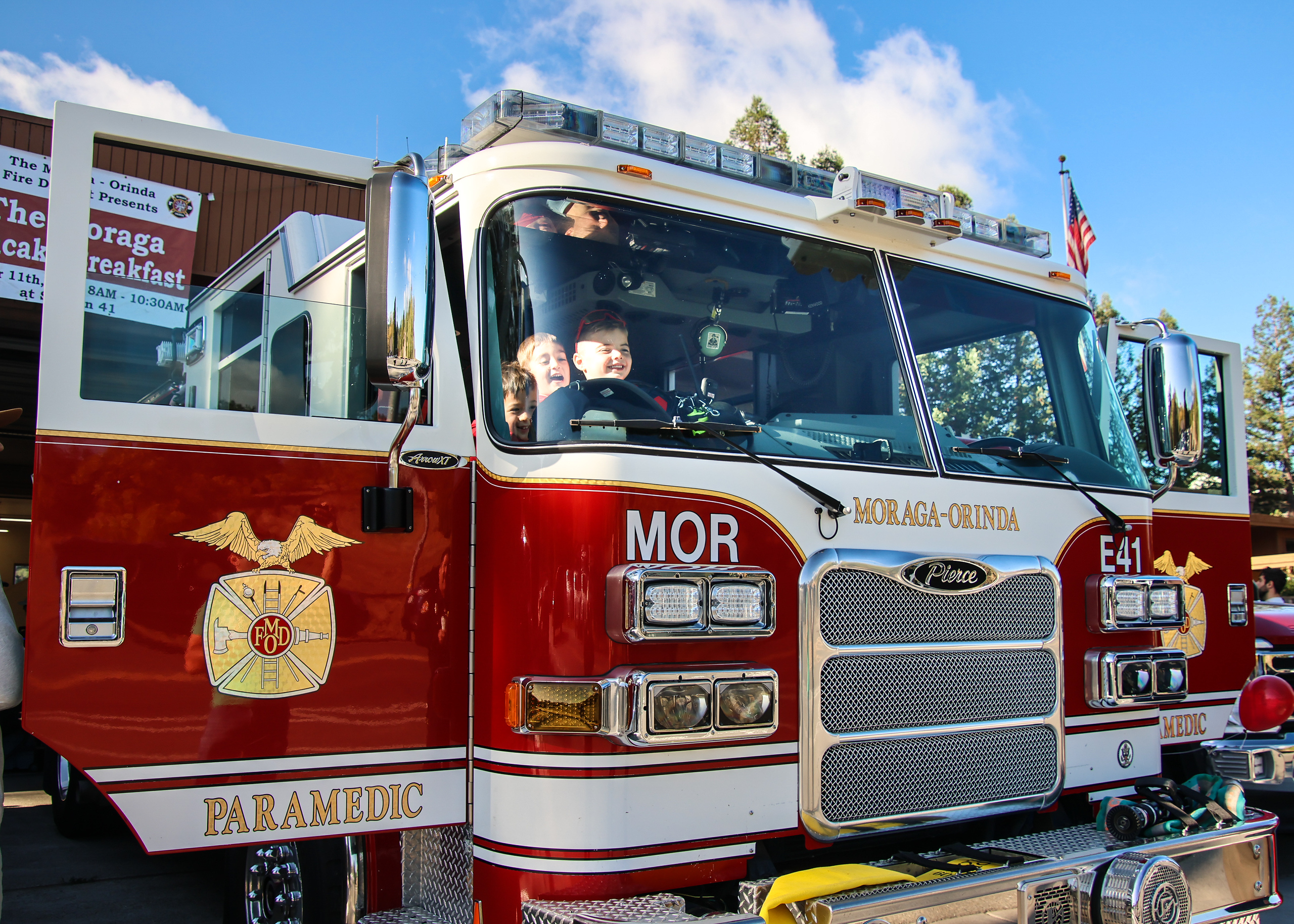 Smaller attendees enjoy time in a fire engine.