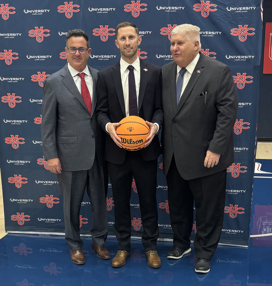 Mickey McConnell at his introductory press conference as Saint Mary’s Head basketball coach with Mike Matoso Vice President of Intercollegiate Athletics (left) and Roger Thompson, President of Saint Mary’s (right)
