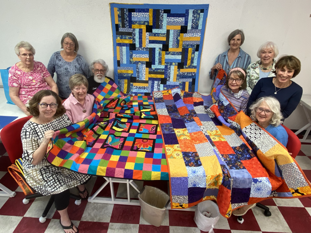 Members of the Foster Kids’ Quilt Group. (Standing, left): Tina de Man and Mary Carpenter; (sitting, left) Susan Dague, Sandi Cummings and Rubin Villa Senor. (Standing, right): Charlotte Sproul, Sally Socolich and Sue Bass, and (sitting, right) Sharon Castro and Gloria Leinbach.