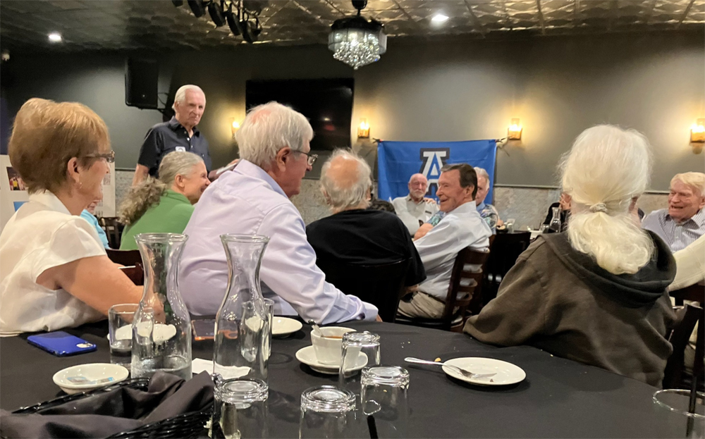 Some of the Acalanes Class of 1956 and 1957 laugh together.