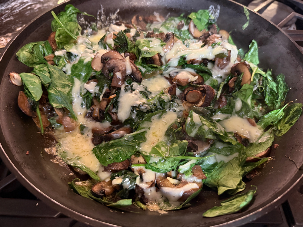 Roasted mushrooms, caramelized shallots, and Gruyère give spinach a deliciously melty makeover