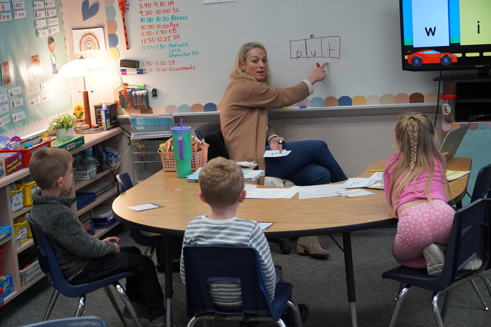 Stephanie Sado works with students on literacy.